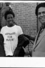 View of Maynard Jackson and a young unidentified supporter wearing a "Maynard for Mayor" t-shirt.