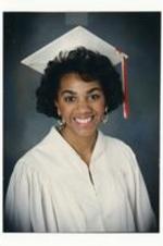 Portrait of Kimberly Floyd wearing graduation regalia.