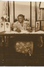 Elizabeth McDuffie sits at a desk.