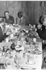 Men sit at a table and eat at a breakfast honoring California Judge David W. Williams.
