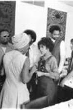 Men and women talk at a reception at the Conference to Access the State of Black Arts and Letters in Chicago, IL. May 26-28, 1972.