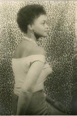 Portrait of Ethel Ayler in front of a leopard print background. Written on verso: Ethel Ayler as Zirata in Simply Heavenly by Langston Hughes; Photograph by Carl Van Vechten; 146 Central Park West; Cannot be reproduced without permission; June 10, 1957.