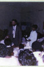 Nathaniel Stampley and his wife walking through tables at the 1979 senior breakfast.