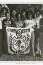 Outdoor group portrait of young women, holding rug "Gamma Zeta".