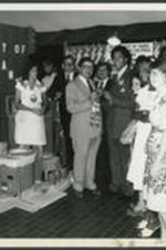 Maynard Jackson accepts a ribbon with a potter at a City of Atlanta cultural event.