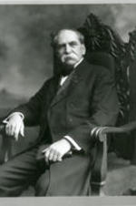 Portrait of Dr. David Estes sitting in a chair.