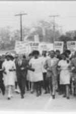 Joseph and Evelyn Lowery are shown marching with Ralph and Juanita Abernathy, UAW representatives, and others during a hospital strike in Charleston, South Carolina. Written on verso: Prop of E.G. Lowery; Hospital -1199 Charleston, S.C. 1969; Carl Ferris; L. Wadrey[?]; Fauntroy; hosp. worker; Walter Reuther; Pres. 1199; Ralph &amp; J. Abernathy; Joseph and Evelyn Lowery
