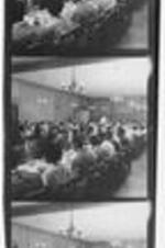 Contact sheet showing the interior of a dormitory dining hall filled with students eating at tables.