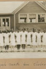 Girls stand outside of the Chadwick School. Written on recto: Eighth grade graduates from Chadwick School.