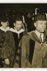Edward A. Jones and Langston Hughes wear graduation regalia. Written on verso: Edward A. Jones, Langston Hughes, Atlanta University Commencement June 2, 1947.