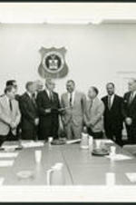 Dr. Vivian Wilson Henderson with unidentified men serving on a consultation committee at the United States Department of Labor.