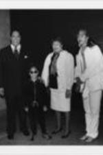 Mayor Maynard Jackson, Raven-Symone, Evelyn G. Lowery, and Carolyn Watson are shown posing for a picture during a SCLC/W.O.M.E.N. Christmas party for the children of Atlanta.