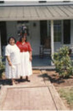 Two women stand outside of Alex Haley's house in Tennessee.