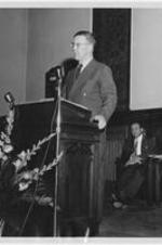 Professor P. A. Sorokin from Harvard speaks from the pulpit at Gammon chapel. Harry V. Richardson listens in the background.