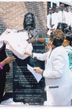 Evelyn G. Lowery and two others unveil the Coretta Scott King memorial monument at Mt. Tabor A.M.E. Zion Church.