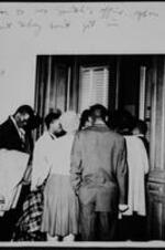 Student SNCC group gathers at the door of Georgia House of Representatives George L. Smith's office. Written on recto: door to Geo. Smith's office - open but they don't get in.