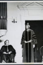 Brailsford R. Brazeal talks with others at a Morehouse College commencement. Left to right: Dr. Brailsford R. Brazeal, Albert Manley, Dr. Benjamin E. Mays, [unidentified].