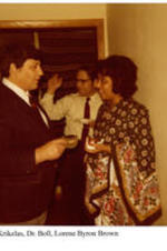 View of Dr. Krikelas, Dr. Boll, and Lorene Byron Brown at a graduation party. Written on recto: Dr. Krikelas, Dr. Boll, and Lorene Byron Brown