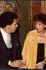 Maynard and Valerie Jackson talk at a reception.