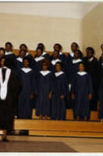 The I.T.C. chorus performs at graduation led by Melva Costen.