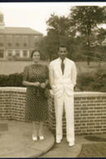 Dr. and Mrs. Brazeal stand outside the Trevor Atrnett building at Atlanta University.