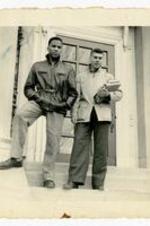 Gladstone "Mickey" Chandler, Jr. and unidentified man posing on steps. Written on verso: In front of the chemistry building.
