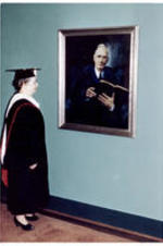 Ruthella Rodeheaver looks at a portrait of her husband, J. N. Rodeheaver, PhD.