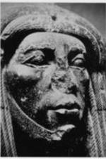A close up of the face of a statue.