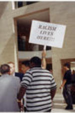 Demonstrators picket inside the lobby of the Creative Artists Agency in Beverly Hills, California.