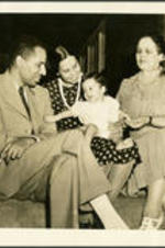 Brailsford R. Brazeal and family sit on the steps of a home porch. Left to right: Brailsford R. Brazeal, (wife) Ernestine E. Brazeal, (daughter) Ernestine Walton Brazeal, (mother/grandmother) Aurelia Howard Frazier.