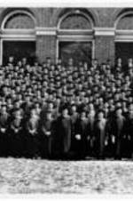 The graduating class of 1964 stand at the steps of an unidentified building for a class photo. Written on verso: Commencement at Southern Baptist Theological Seminary - May, 1964. Th.M. Degree James H. Costen - Back Floor Left.