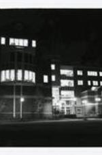 Exterior view of the Camille Olivia Hanks Cosby Building at night.
