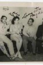 Langston Hughes, with J. Alston, Gladys Alston, and Somersett seated in a living room. Written on recto: J. Alston, Gladys Alston, Langston Hughes, Somersett.