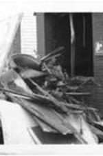 An image of Martin Luther King Jr. sits atop a large pile of debris in front of a burned-out building on Hunter Street. Written on accompanying form: Burned-out bldg on Hunter St. - It would seem cause was.