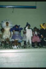 Unidentified children on stage during a play or theatrical program.
