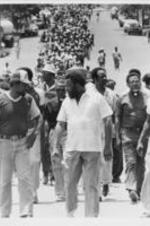 Leadership members of the Southern Christian Leadership Conference, including Spiver Gordon, John Nettles, and Joseph E. Lowery, leads demonstrators in a march prompted by the killing of the Russaw brothers in Eufaula, Alabama.