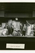 View of actors on stage. Written on verso: Summer Theatre 1963, "Light Up The Sky".