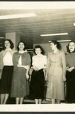Group portrait of Anna Henderson (third from left), wife of Dr. Vivian Wilson Henderson, and five unidentified women.