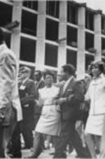 Juanita Abernathy, Ralph D. Abernathy, and Evelyn G. Lowery are shown marching arm in arm down the street with others during a Poor People's Campaign event in Memphis, Tennessee.