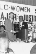 Southern Christian Leadership Conference (SCLC) President Joseph E. Lowery presents the Drum Major For Justice Award in Law &amp; Justice to Morris S. Dees, Jr., the founder of the Southern Poverty Law Center.