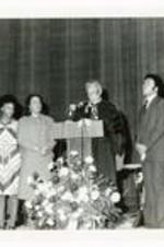 Written on verso: King family members listen as Dr. Thomas Kilgore (at podium) dedicates King Chapel February, 1978.