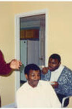Unidentified men talk at C. Eric Lincoln's house.