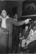 Southern Christian Leadership Conference President Joseph E. Lowery addresses a crowd during the Pilgrimage to Washington kickoff rally held in a gym in Tuskegee, Alabama. Written on verso: Tuskegee, Ala. Apr. 19, '82. Property of J.E. Lowery