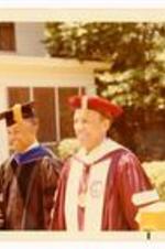Written on verso: Academic Dean Willis J. Hubert, left, and President Hugh M. Gloster, right after Morehouse College Commencement Exercises on June 1, 1971.