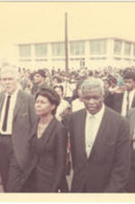 Jackie Robinson and his wife Rachael Robinson walk to Morehouse College as part of Martin Luther King Jr.'s funeral procession.