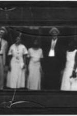 View of an unidentified group of men and women.