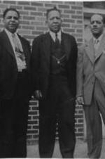 Leroy Lowery (center?, Joseph E. Lowery's father) poses for a photo with two unidentified men. Written on verso: Feb. 28 '49