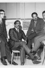 A group of faculty. Written on verso: New faculty faces. L-R: Gerard Kuiper, Gayraud Wilmore, George Thomas and Gladstone Mtlabat.