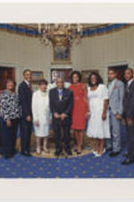A group photo of Joseph E. Lowery with his family and President Barack Obama and First Lady Michelle Obama on the day he was awarded the Presidential Medal of Freedom. From left to right: Cheryl Lowery, Karen Lowery, Yvonne Lowery, Barack Obama, Evelyn G. Lowery, Joseph E. Lowery, Michelle Obama, unidentified woman, Lowery grandchild [unidentified], Lowery grandchild [unidentified], unidentified man.