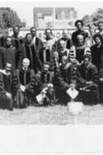 A group of students and faculty pose in front of the ITC sign on campus for convocation. Written on verso: Back row standing left to right: E. P. Wimberly, J. M. Shopshire, J. Jackson, G. B. Thomas, R. C. Briggs, T. Hoyt, G. J. Kuiper, J. C. Diamond, J. E. Lantz. Middle row standing left to right: A. L. Dopson, Q. R. Gordon, O. J. Haney, J. H. Costen, C. B. Copher, H. V. Richardson, M. J. Jones, B. J. Saucer, C. W. Cone, M. Thomas. Front row kneeling left to right: W. N. Flemister, B. E. Goodwin, T. W. Smith, M. C. Jackson, R. E. Penn, I. R. Clark, C. J. Sargent.